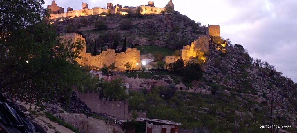 a castle perched on top of a mountain at Casa María in Moclín