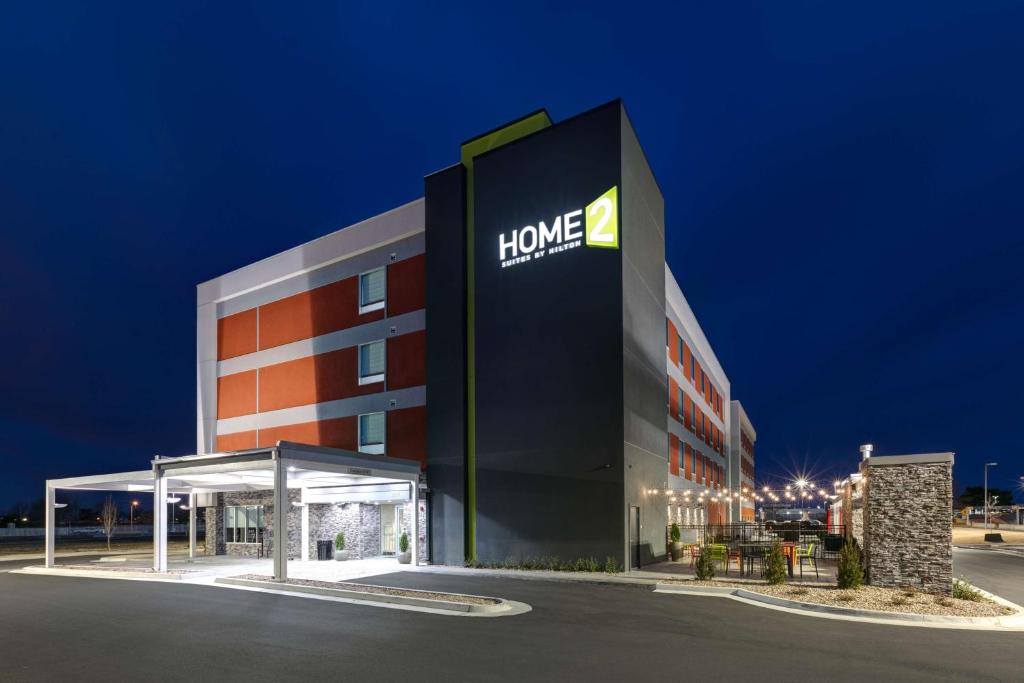 a building with a home healthcare sign on it at Home2 Suites By Hilton Tulsa Airport in Tulsa