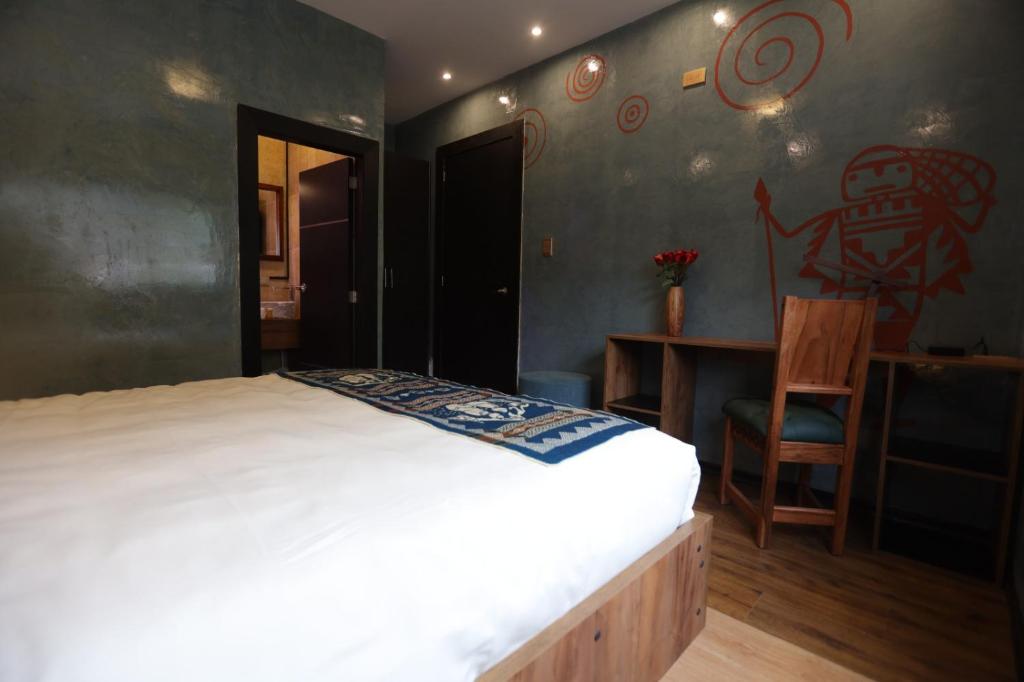 Postel nebo postele na pokoji v ubytování Chakana Hotel Boutique Mariscal