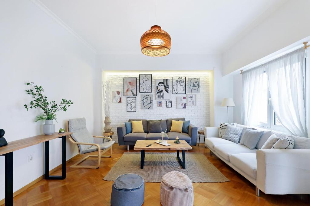 a living room with a couch and a table at Central Kolonaki flat B - Greecing in Athens