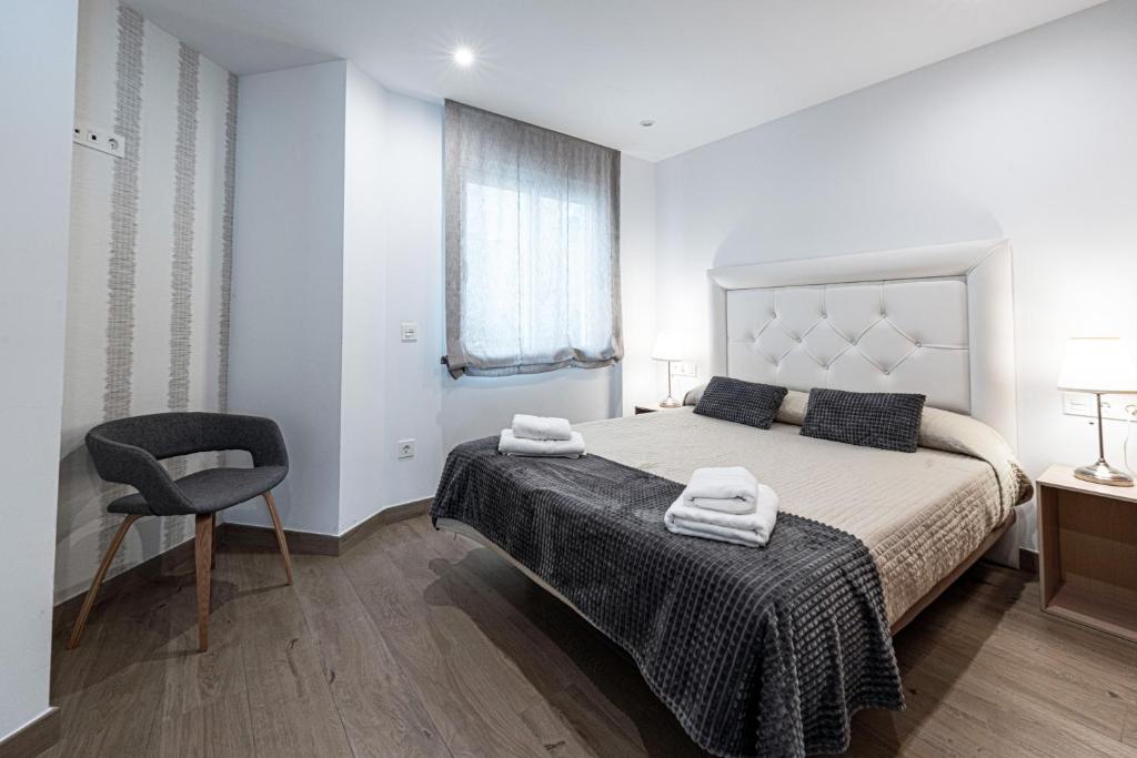 Posteľ alebo postele v izbe v ubytovaní Hostal Boutique Aurora