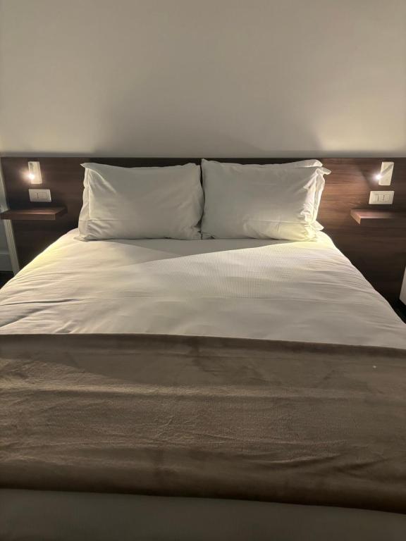 Postel nebo postele na pokoji v ubytování L' Antico Borgo Ibla