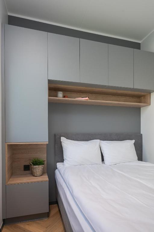 Postel nebo postele na pokoji v ubytování Rare Apartments - Self Check-In Miniapartments