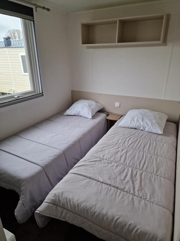 Postel nebo postele na pokoji v ubytování Eleganzia 2