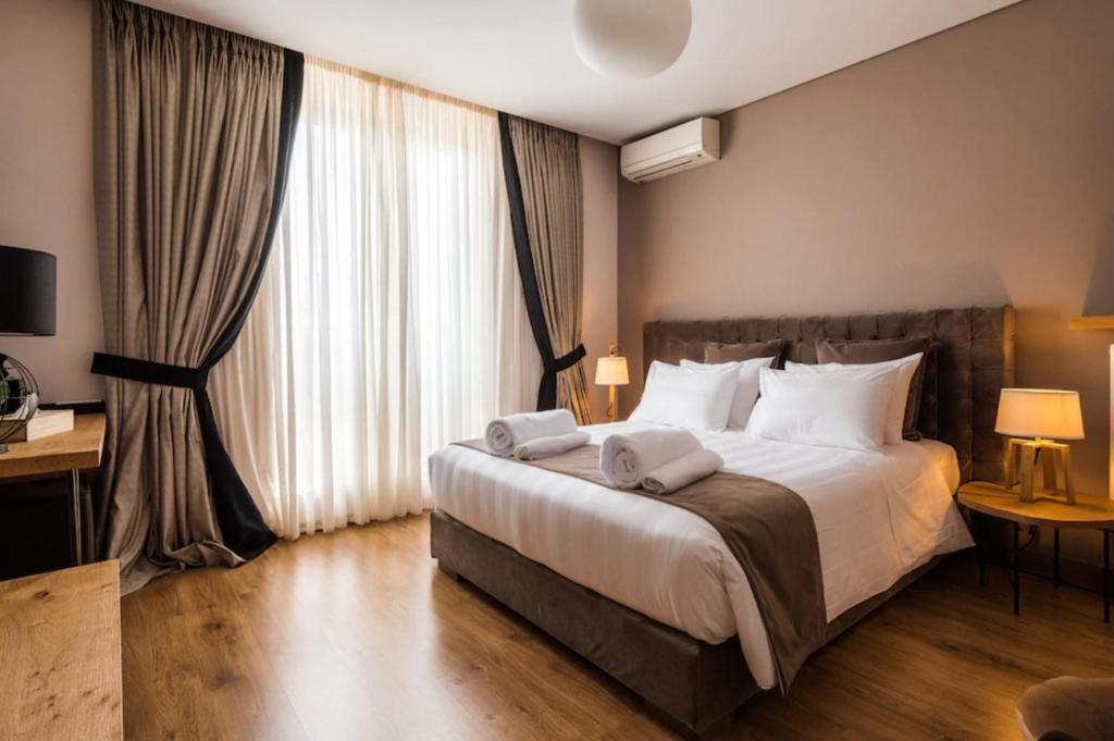 Кровать или кровати в номере Penthause Apartament