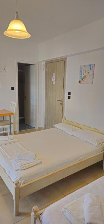 Postel nebo postele na pokoji v ubytování Argiropouloi
