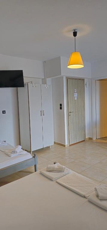 Postel nebo postele na pokoji v ubytování Argiropouloi