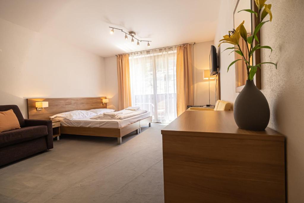 Postel nebo postele na pokoji v ubytování Fatrapark 2 Apartments House