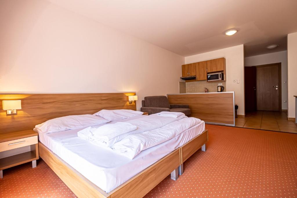 Postel nebo postele na pokoji v ubytování Fatrapark 2 Apartments House