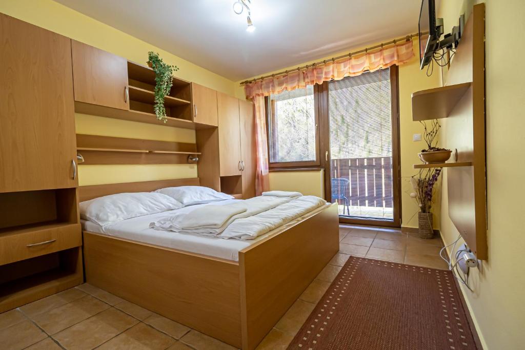 Postel nebo postele na pokoji v ubytování Fatrapark 2 Apartments House