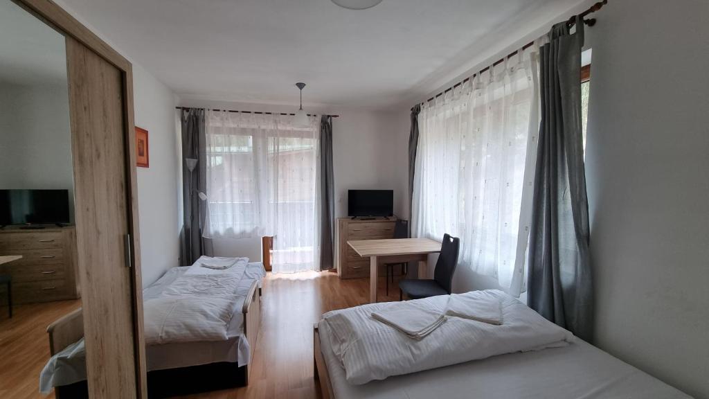 Postel nebo postele na pokoji v ubytování Fatrapark 2 Apartments House
