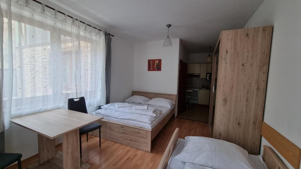 Postel nebo postele na pokoji v ubytování Fatrapark 2 Apartments House