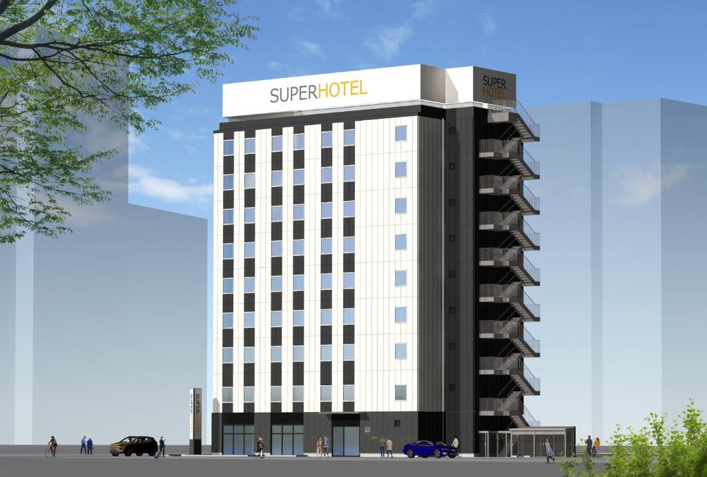 仙台Super Hotel Sendaieki Higashiguchi Tennenonsen的建筑的 ⁇ 染,上面有标志