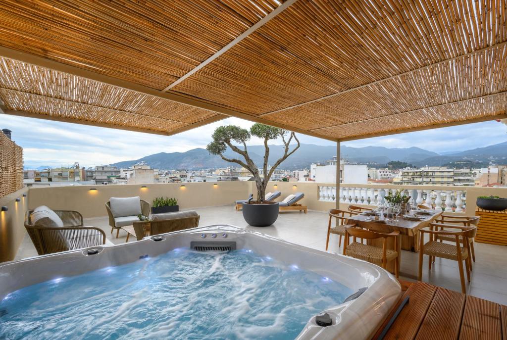a hot tub on the roof of a house at Balcony Luxury Apartment Kalamata in Kalamata