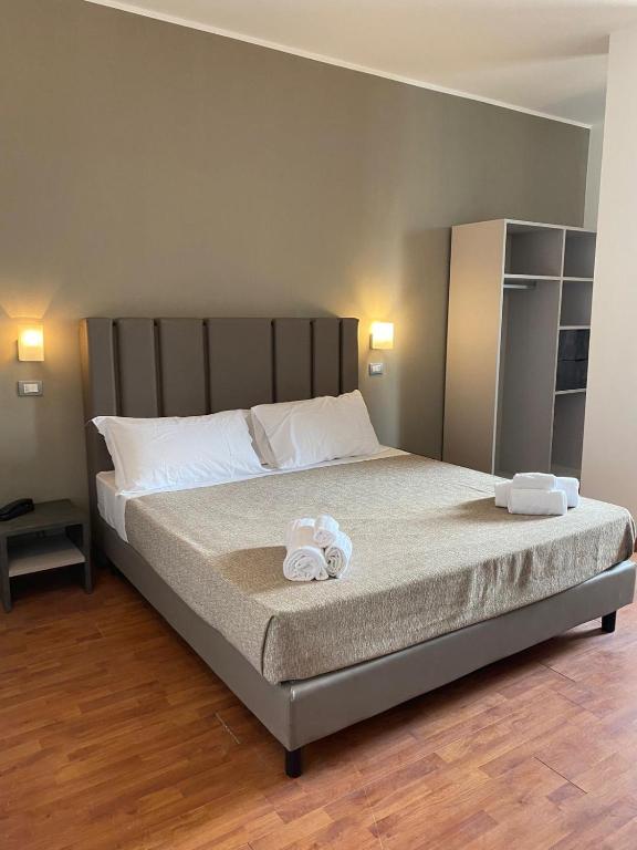 Postel nebo postele na pokoji v ubytování Hotel Golden