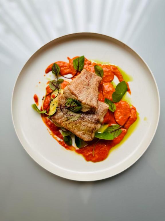 a plate of food on a white plate at Clarion Congress Hotel Bratislava in Bratislava