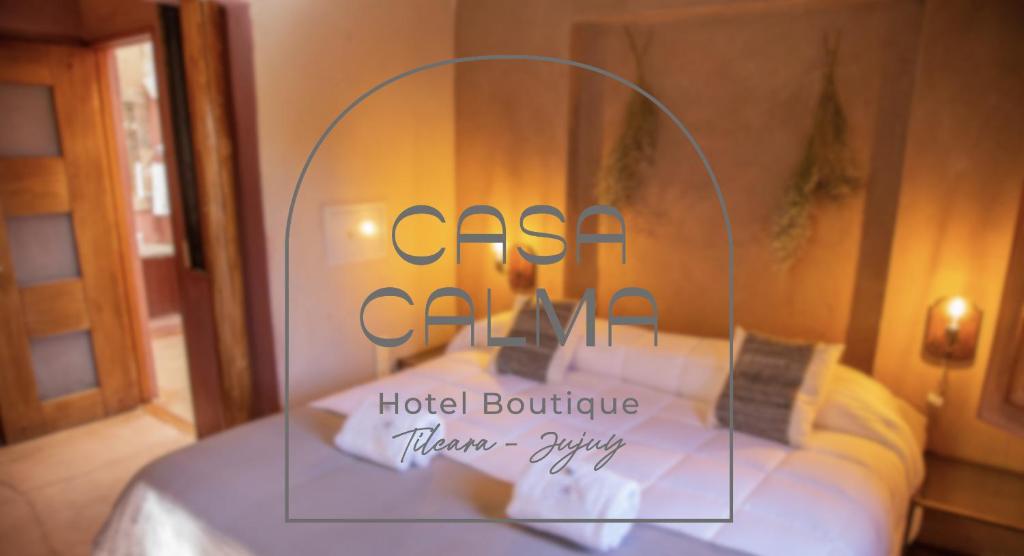 a sign for a hotel boutique virgin city at CasaCalma Hotel Boutique in Tilcara