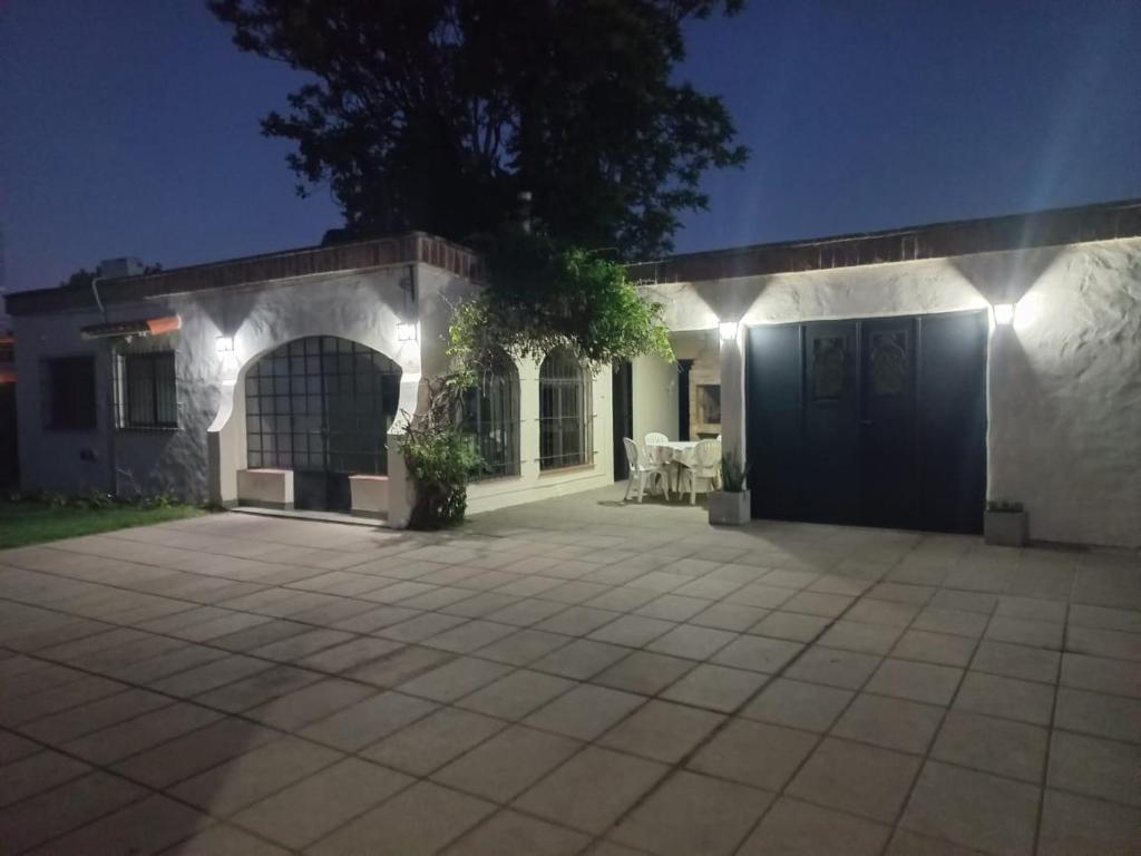 a house with lights on the side of it at La Casita Junin in Junín