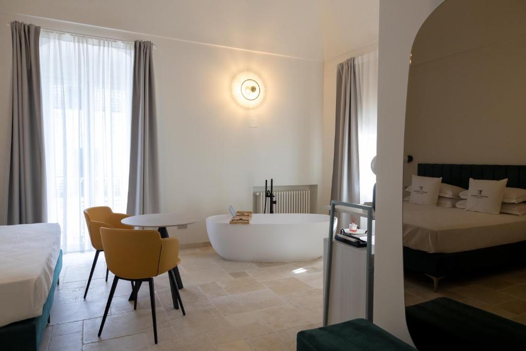 Postel nebo postele na pokoji v ubytování Suites Dimora Garibaldi