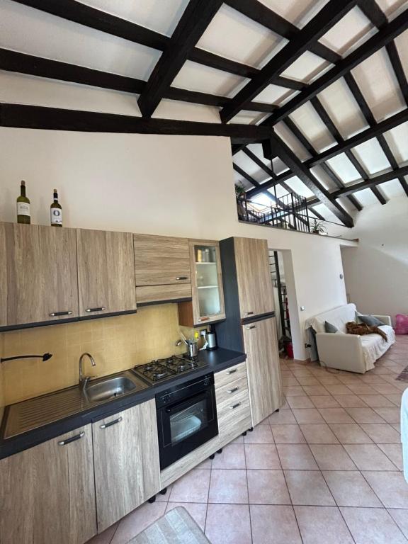 a kitchen with a sink and a stove top oven at Appartamento spazioso in centro in Viterbo