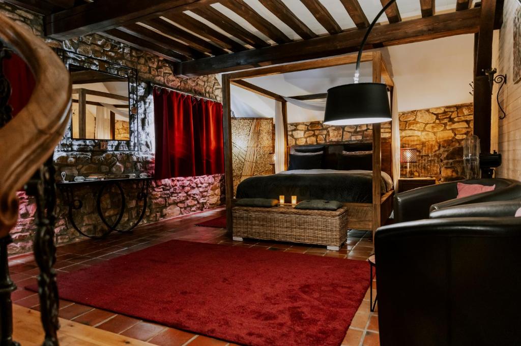 Posezení v ubytování L'Eden - Suite privative avec jacuzzi et sauna