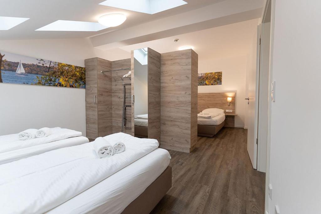 Postel nebo postele na pokoji v ubytování Aparthotel Oberfeld West München, Selbstversorgerhotel