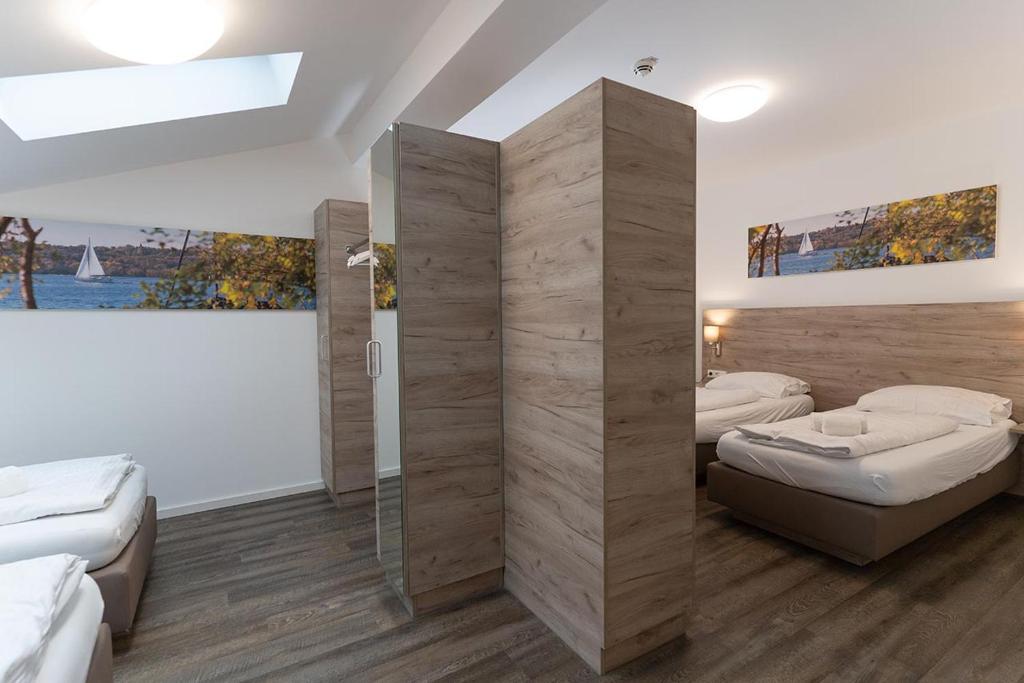 Postel nebo postele na pokoji v ubytování Aparthotel Oberfeld West München, Selbstversorgerhotel