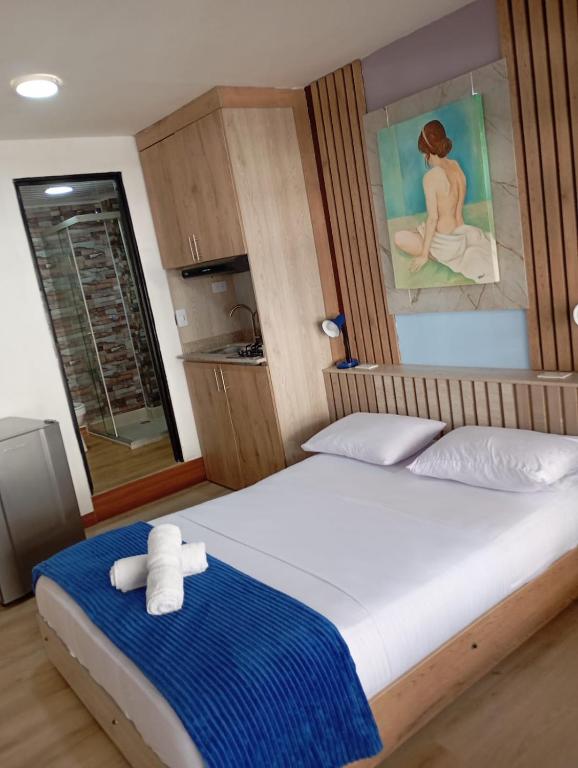Postel nebo postele na pokoji v ubytování Hotel Lares 70 Laureles