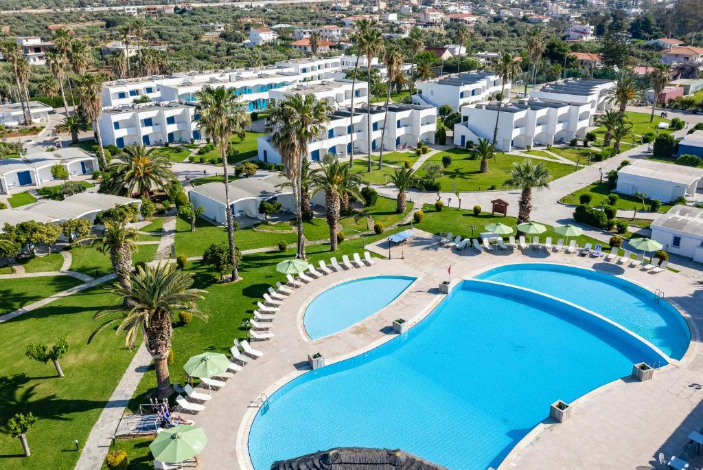 an aerial view of a resort with a large swimming pool at Kinetta Beach Resort and Spa in Kineta