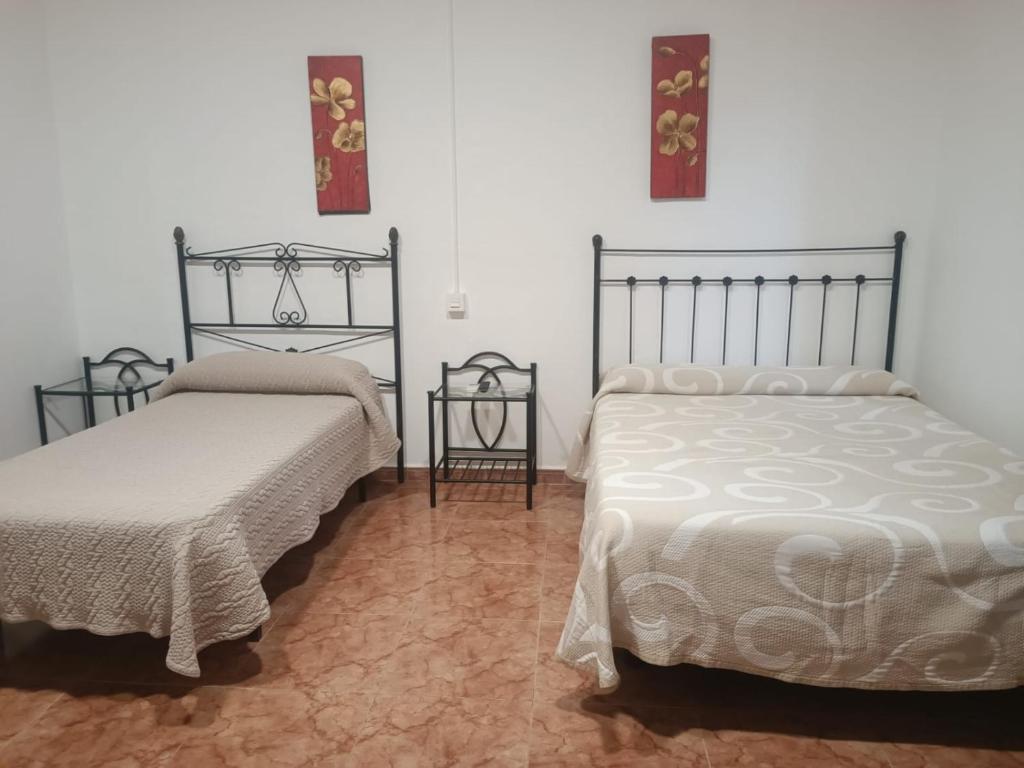 Postel nebo postele na pokoji v ubytování ROOMS Los MONTES