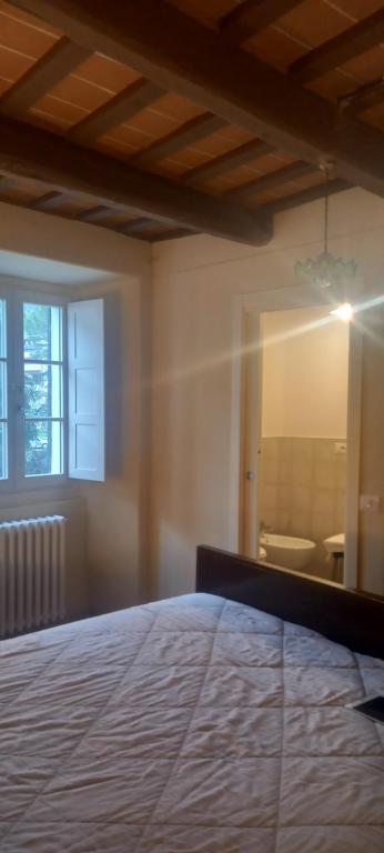 Posteľ alebo postele v izbe v ubytovaní Albergo del Ponte