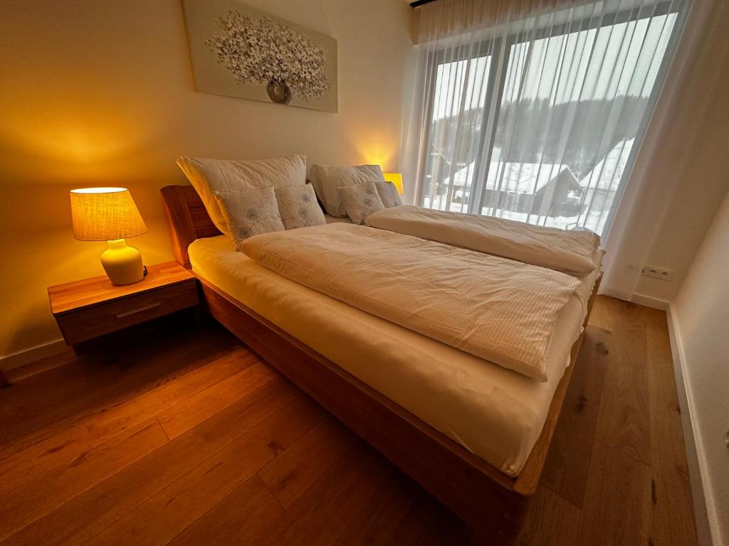 Postel nebo postele na pokoji v ubytování Apartmány Pampeliška