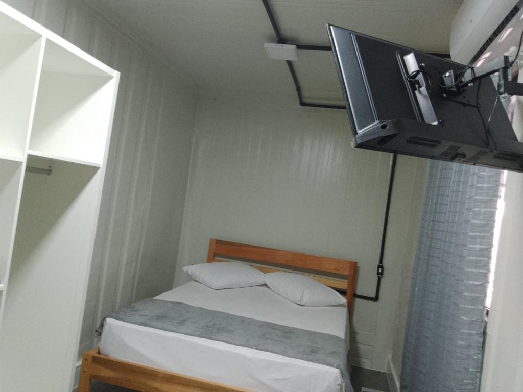 เตียงในห้องที่ Hotel, Pousada e Residencial Apoena