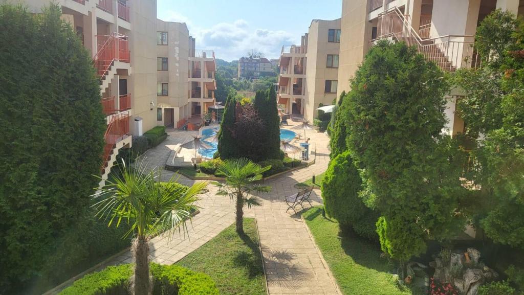 an aerial view of a courtyard with trees and buildings at Апартамент Blue sky in Sinemorets