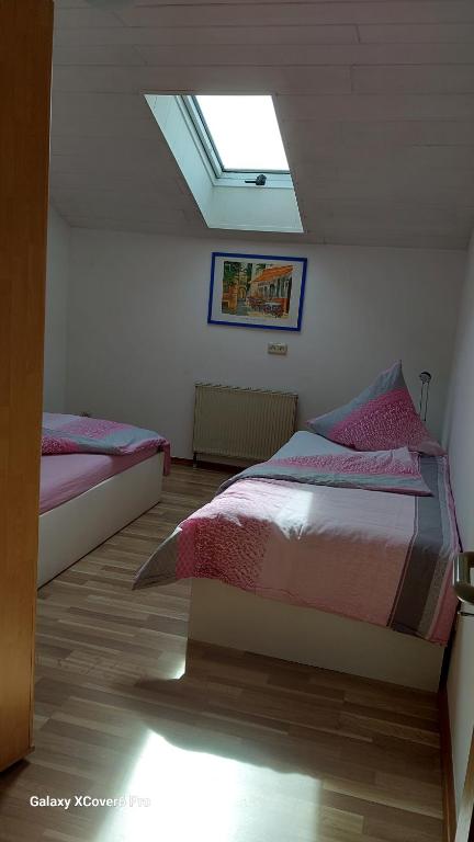 Postel nebo postele na pokoji v ubytování Hildes Nest