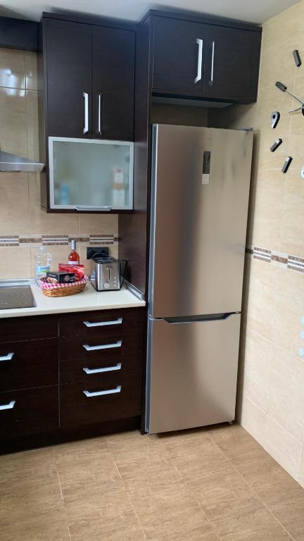 A kitchen or kitchenette at Apartamento Ginette SunBeach