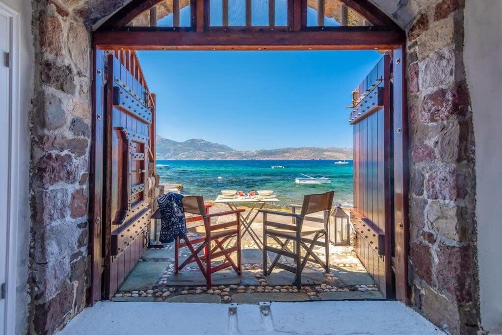 a room with a view of the ocean at Gorgeous Apt in front of the Sea at Klima Milos in Klima