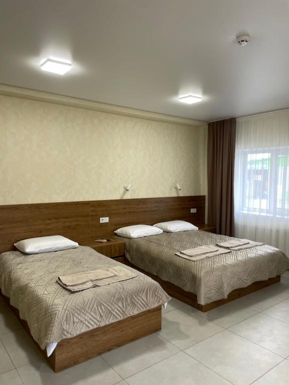 Postel nebo postele na pokoji v ubytování Hotel Voyage Вояж