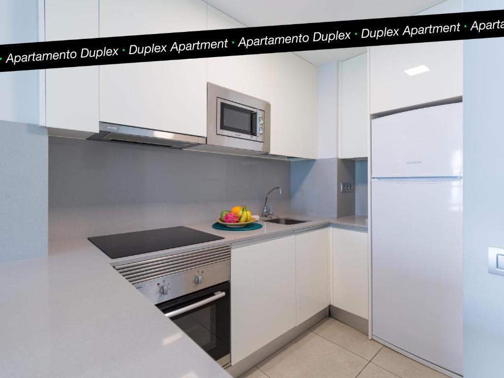 A kitchen or kitchenette at Tusity Yeah Apartments