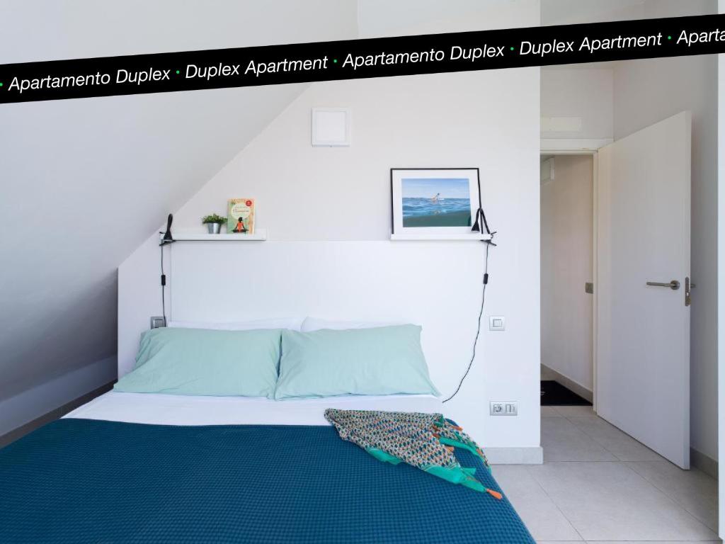 A bed or beds in a room at Tusity Yeah Apartments