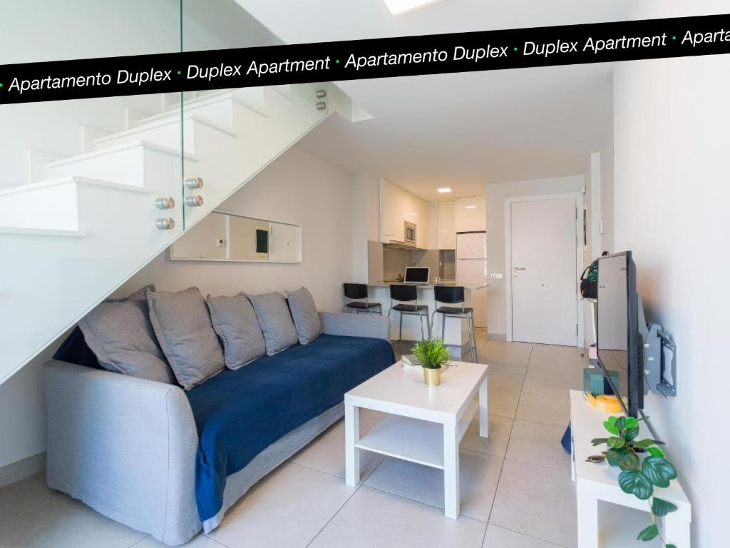 A seating area at Tusity Yeah Apartments