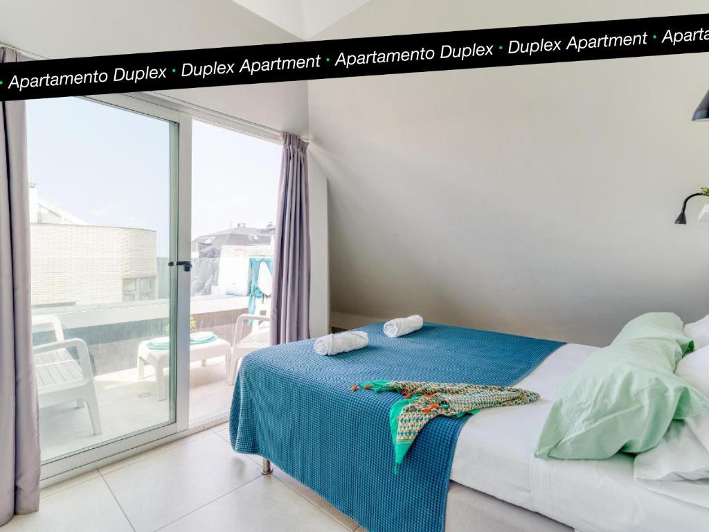 A bed or beds in a room at Tusity Yeah Apartments
