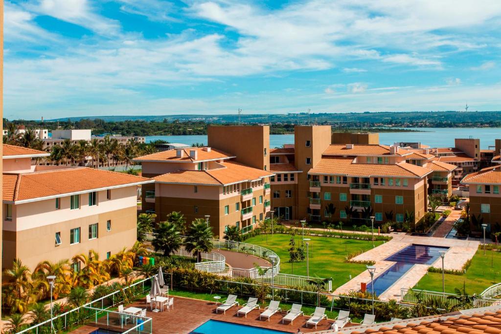 an aerial view of a resort with a body of water at The Sun Full Condominiun in Brasilia