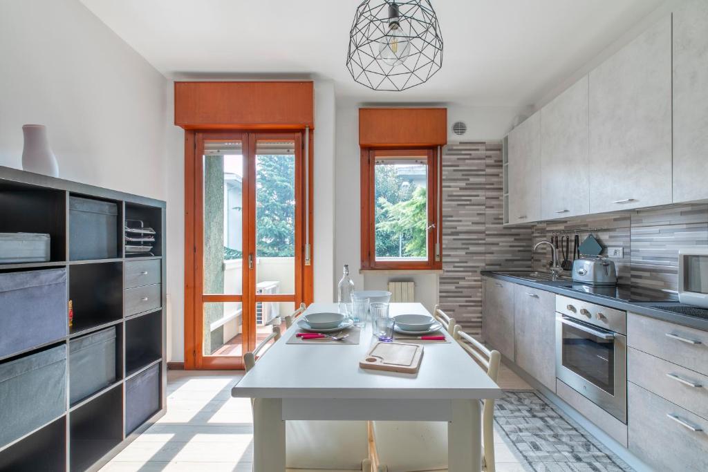 a kitchen with a table in the middle of it at Casa Miri - Padova in Padova