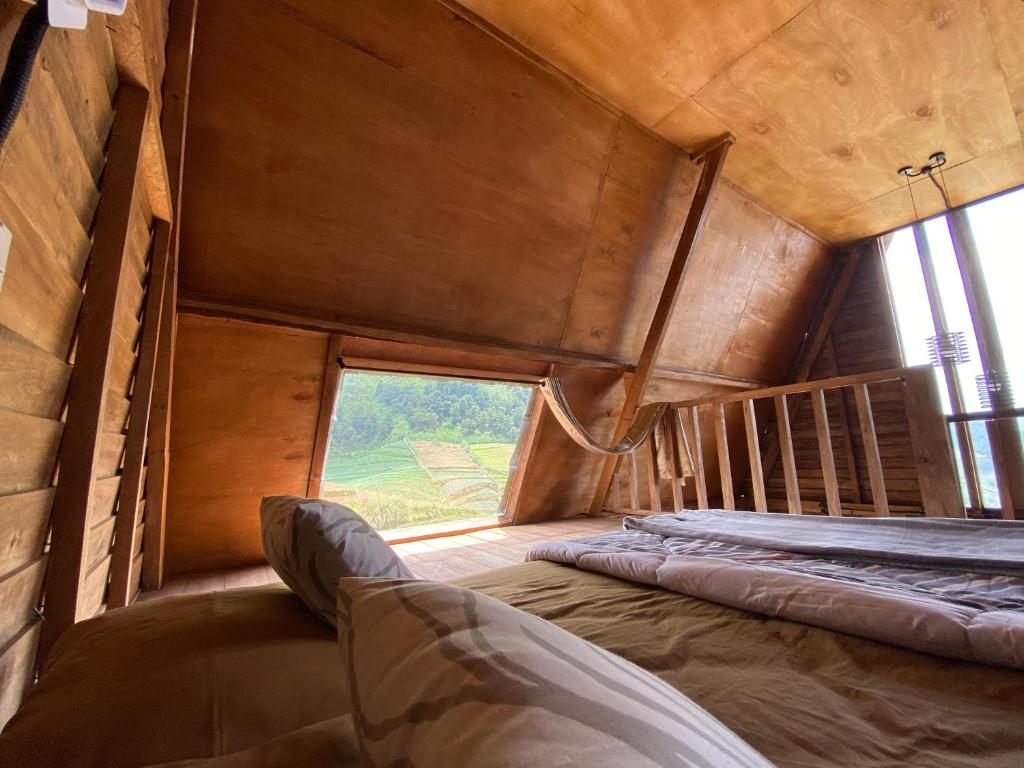 Postel nebo postele na pokoji v ubytování Satha private villa Dieng