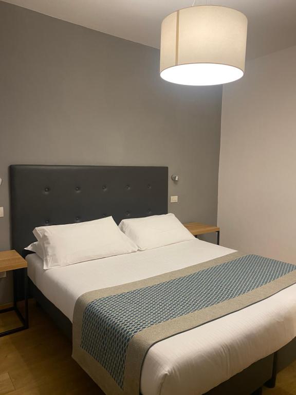 Postel nebo postele na pokoji v ubytování Hotel dei Gonzaga