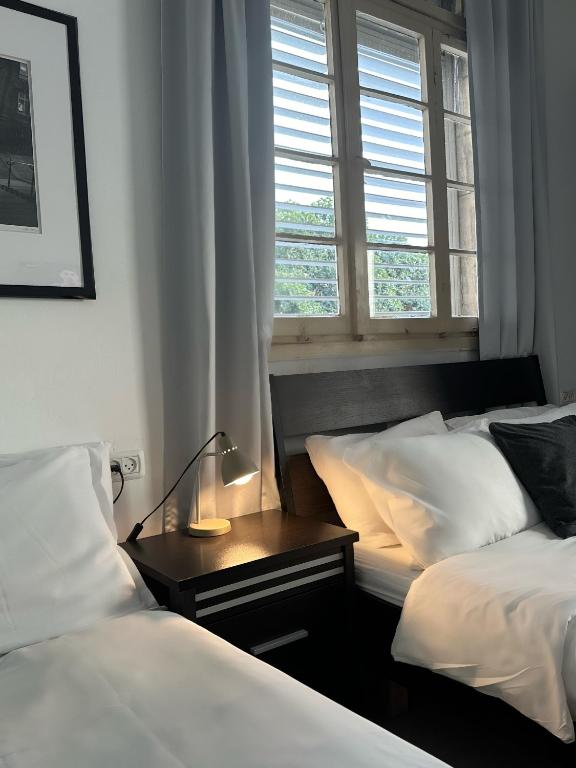 Postel nebo postele na pokoji v ubytování Eden Hotel