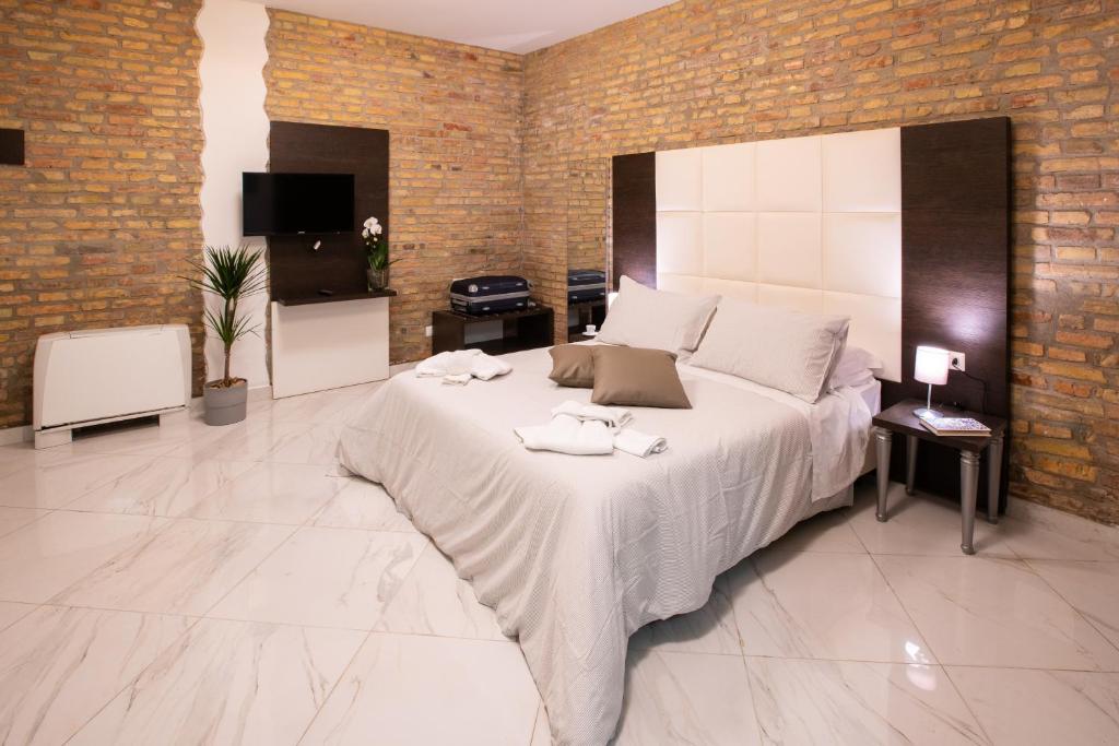Posteľ alebo postele v izbe v ubytovaní Morin 10 Rome Exclusive Suites