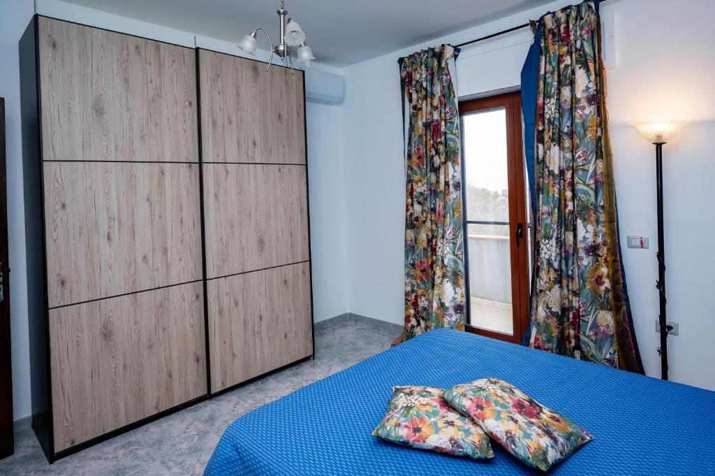 A bed or beds in a room at Casa Vacanze D'Urso