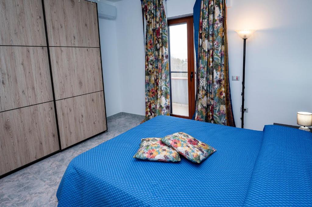 A bed or beds in a room at Casa Vacanze D'Urso